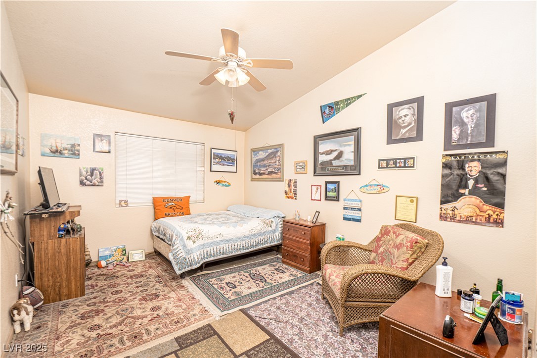 475 East Robindale Road Las Vegas, NV 89123 - Photo 14 of 41 Bedroom with lofted ceiling and ceiling fan