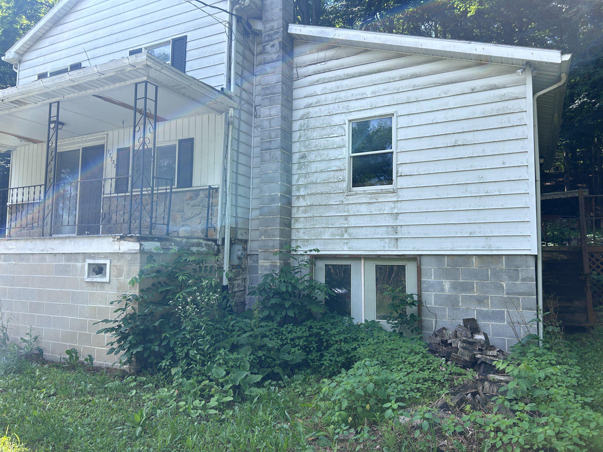 17738 Amberson Road Spring Run, PA 17262 - Photo 2 of 23 a view of a house with brick walls and a yard