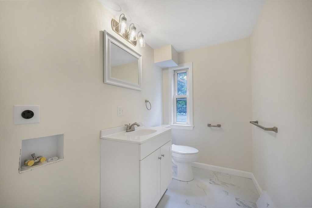1030 Oak Street Dighton, MA 02764 - Photo 19 of 20 a bathroom with a toilet sink and mirror