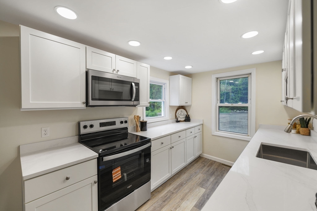 1030 Oak Street Dighton, MA 02764 - Photo 8 of 20 a kitchen with a sink a stove and cabinets