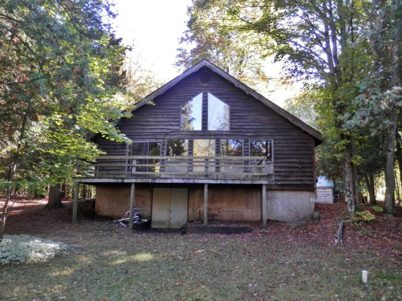 14876 Old Grade Road Thompsonville, MI 49683 - Photo 4 of 25 House has wall of windows to river