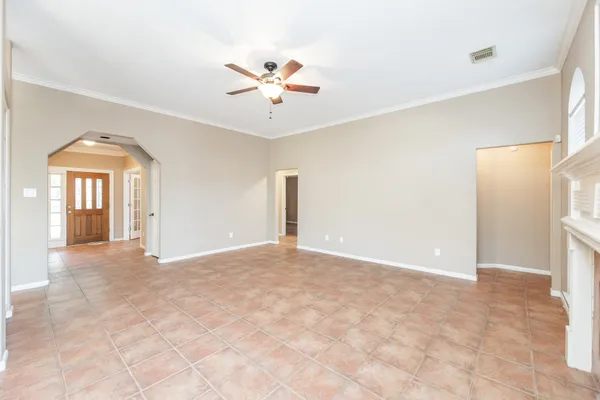 a view of a big room with closet and a chandelier fan