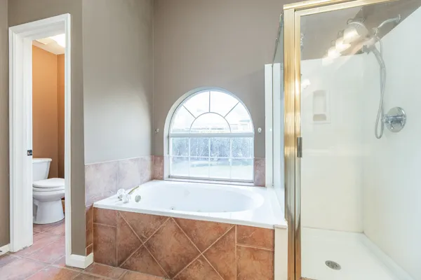 a bath tub sitting next to a window