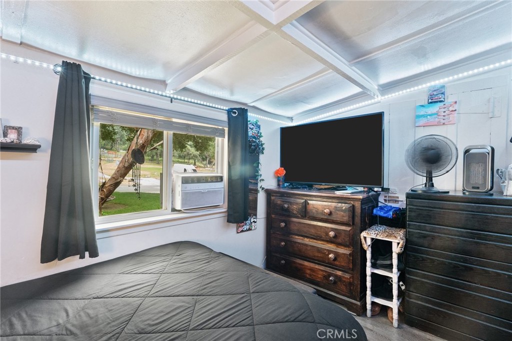 7553 McGroarty Street Tujunga, CA 91042 - Photo 15 of 26 a room with furniture and flat screen tv