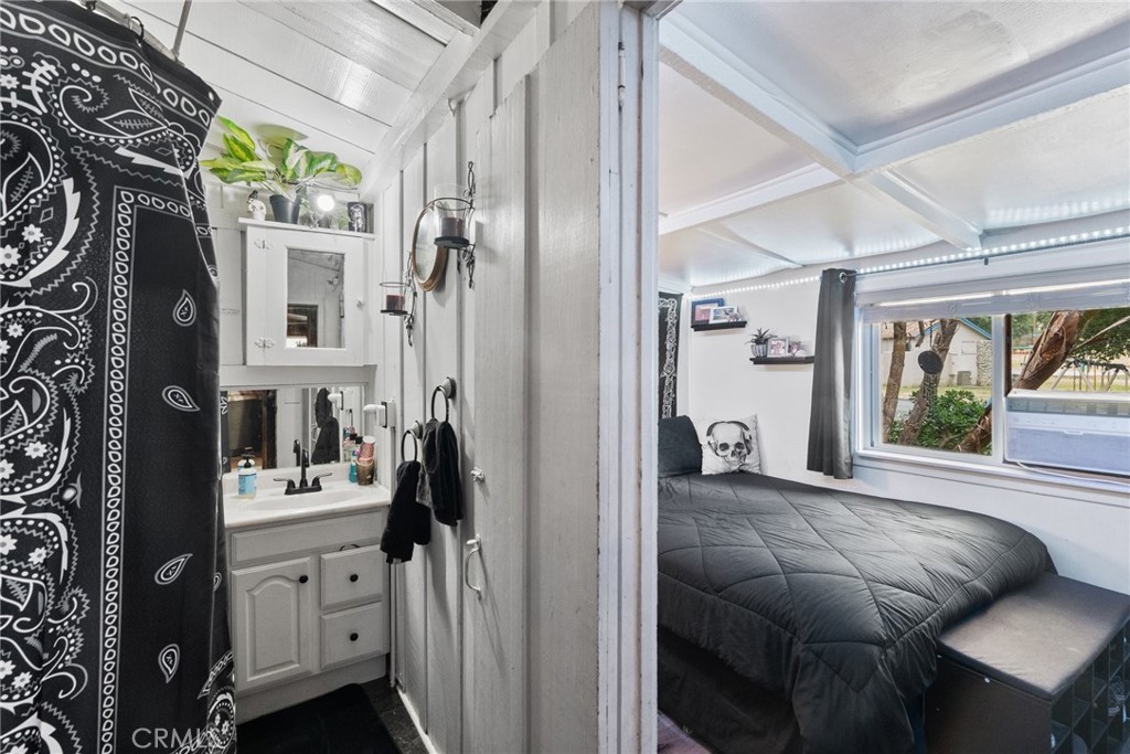 7553 McGroarty Street Tujunga, CA 91042 - Photo 18 of 26 a en suite bathroom with sink and mirror
