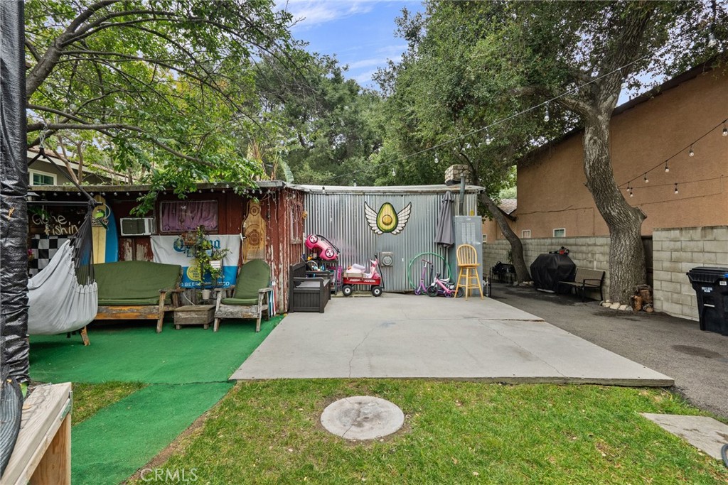 7553 McGroarty Street Tujunga, CA 91042 - Photo 23 of 26 an outdoor view of the house and cars park