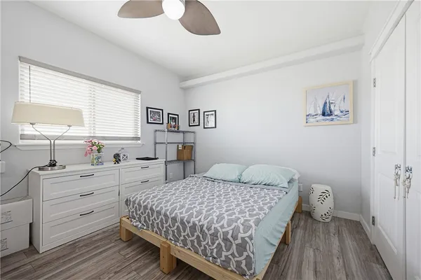 a bedroom with a bed and a dresser