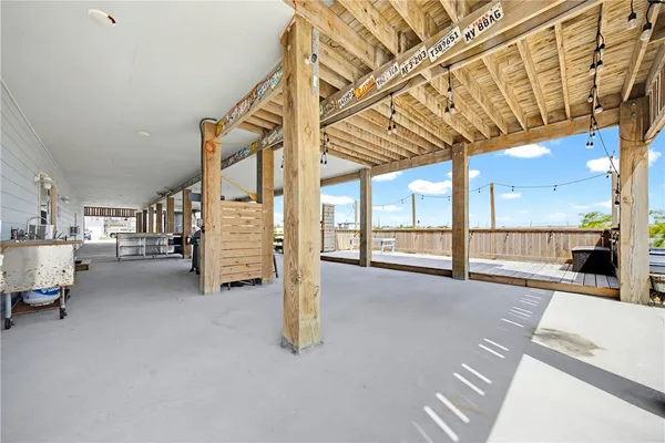 a view of empty room with large windows