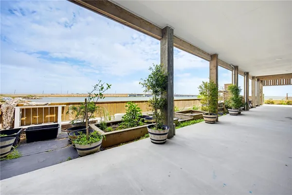 a side view of a house with outdoor seating