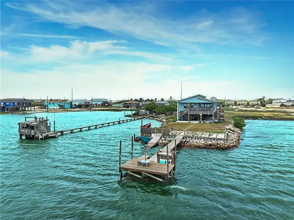 a view of a lake with a yard