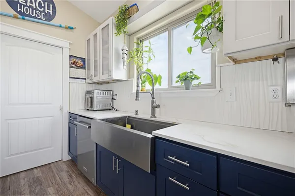 a kitchen with a sink and a refrigerator