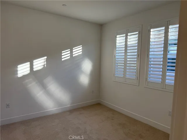 an empty room that has a window