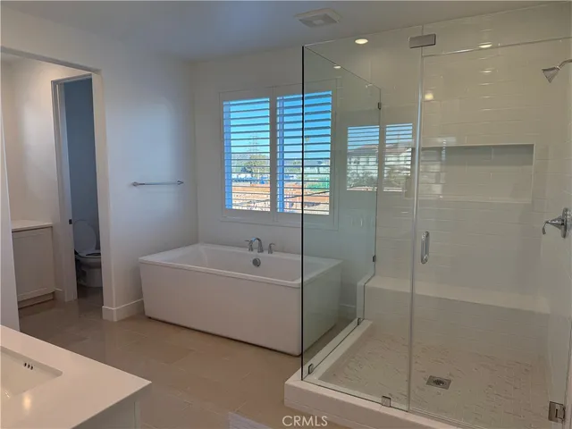 a bathroom with a bathtub and a shower