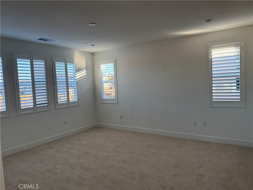 1204 Hinnen Avenue Hacienda Heights, CA 91745 - Photo 22 of 25 an empty room with windows