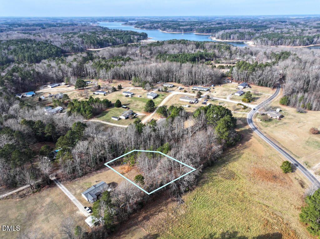 55 Spring Lane Henderson, NC 27537 - Photo 2 of 17 an aerial view of a house with a yard swimming pool and mountains