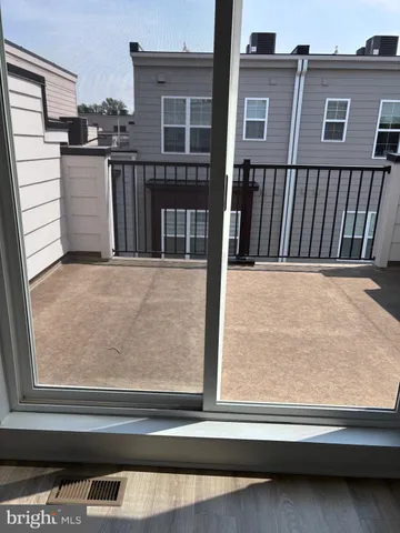 a view of a balcony and front door