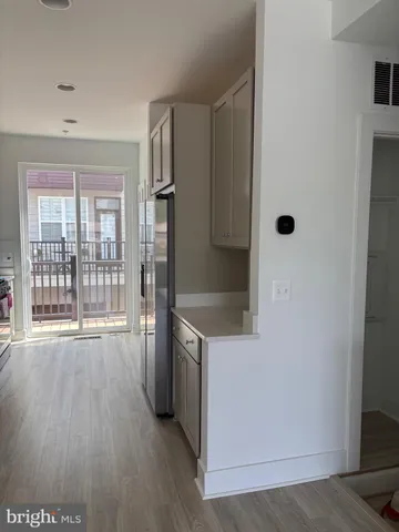 a room with wooden floor and a table