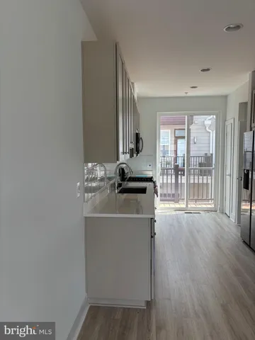 a white toilet sitting next to a small wooden toilet