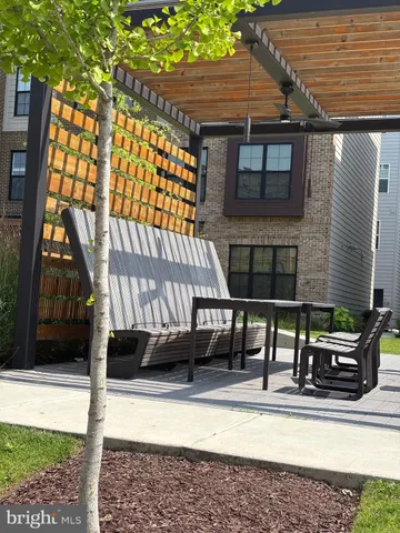 a view of swimming pool with seating space