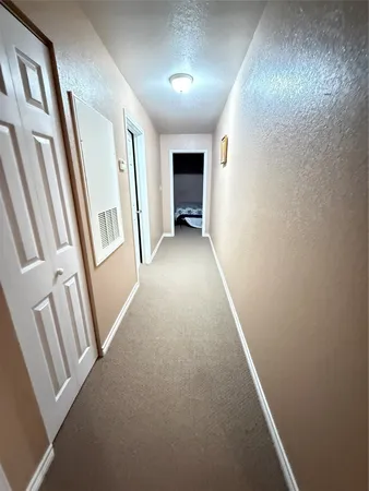 wooden floor in an empty room with a fireplace