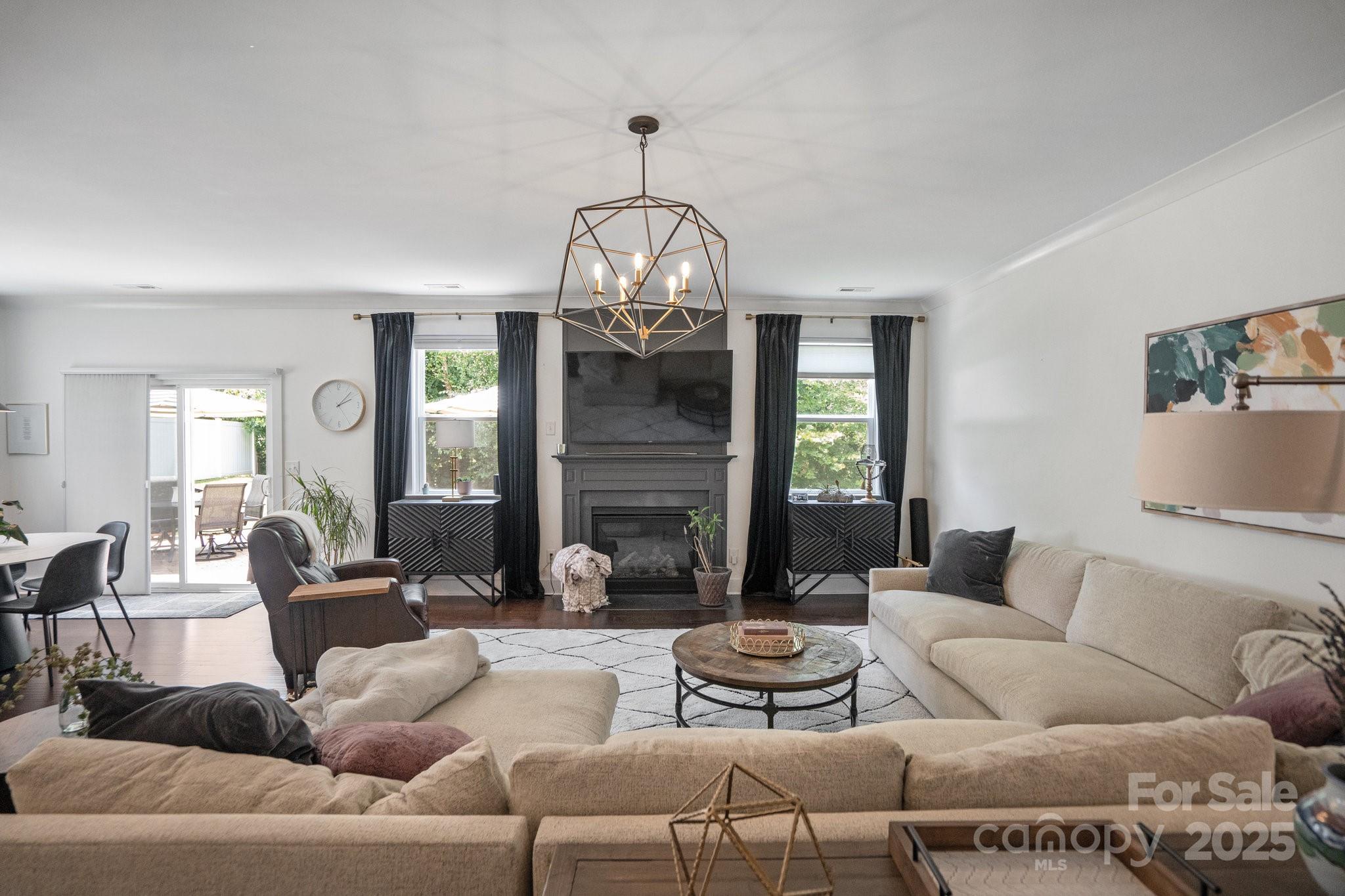 17423 Summers Walk Boulevard Davidson, NC 28036 - Photo 14 of 40 a living room with furniture chandelier and a fireplace