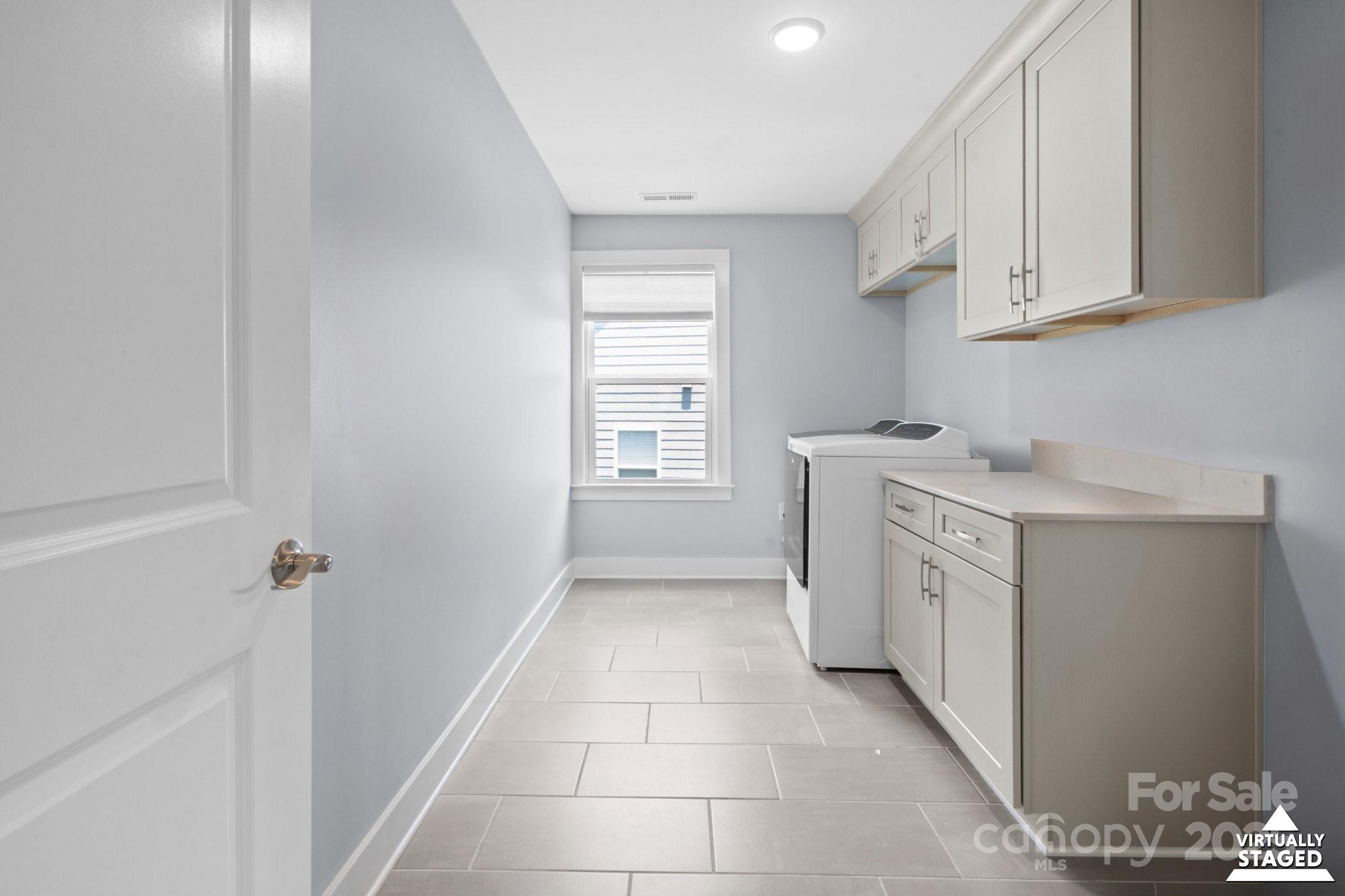 17423 Summers Walk Boulevard Davidson, NC 28036 - Photo 21 of 40 a utility room with cabinets washer and dryer