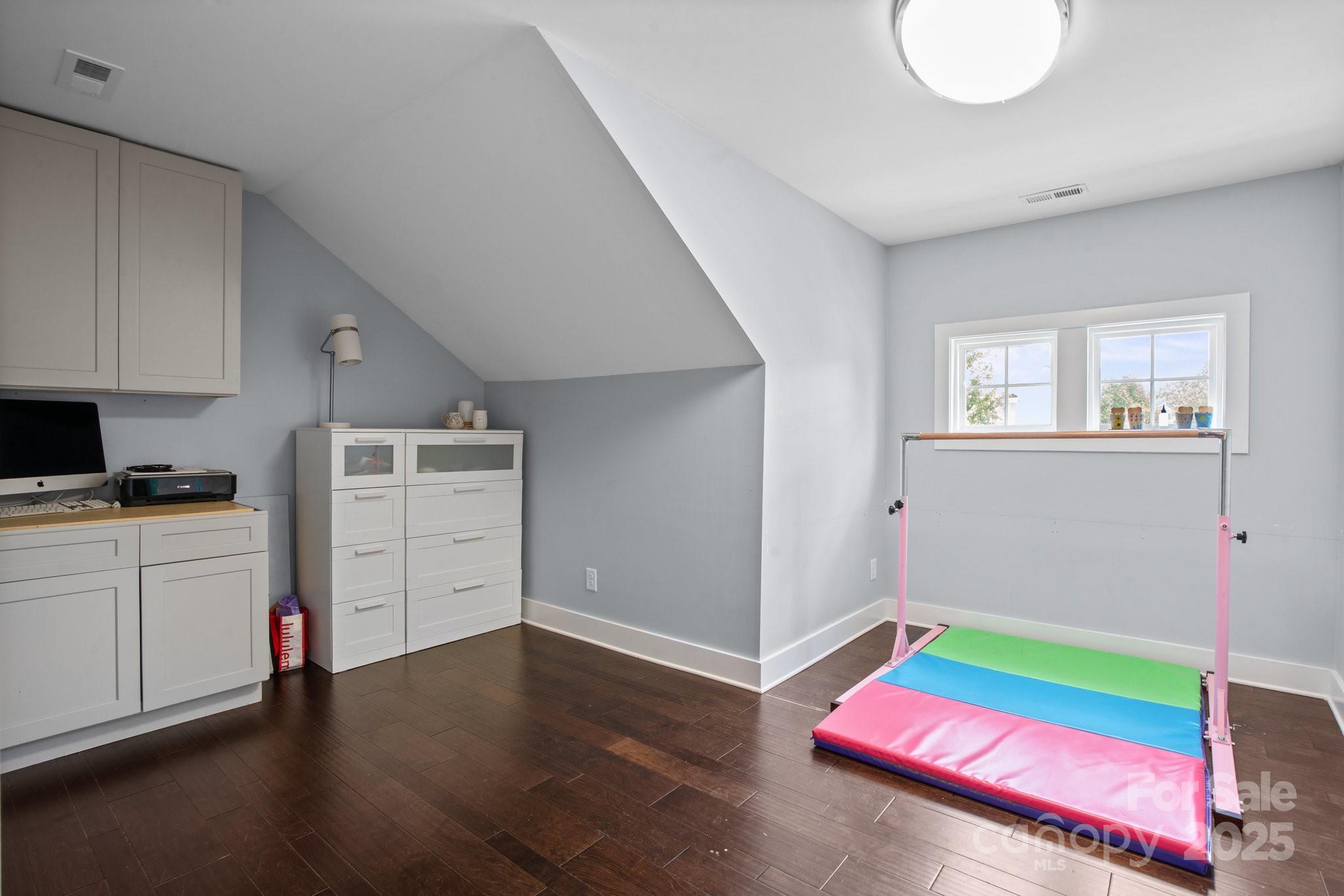 17423 Summers Walk Boulevard Davidson, NC 28036 - Photo 22 of 40 a room with furniture and a wooden floor