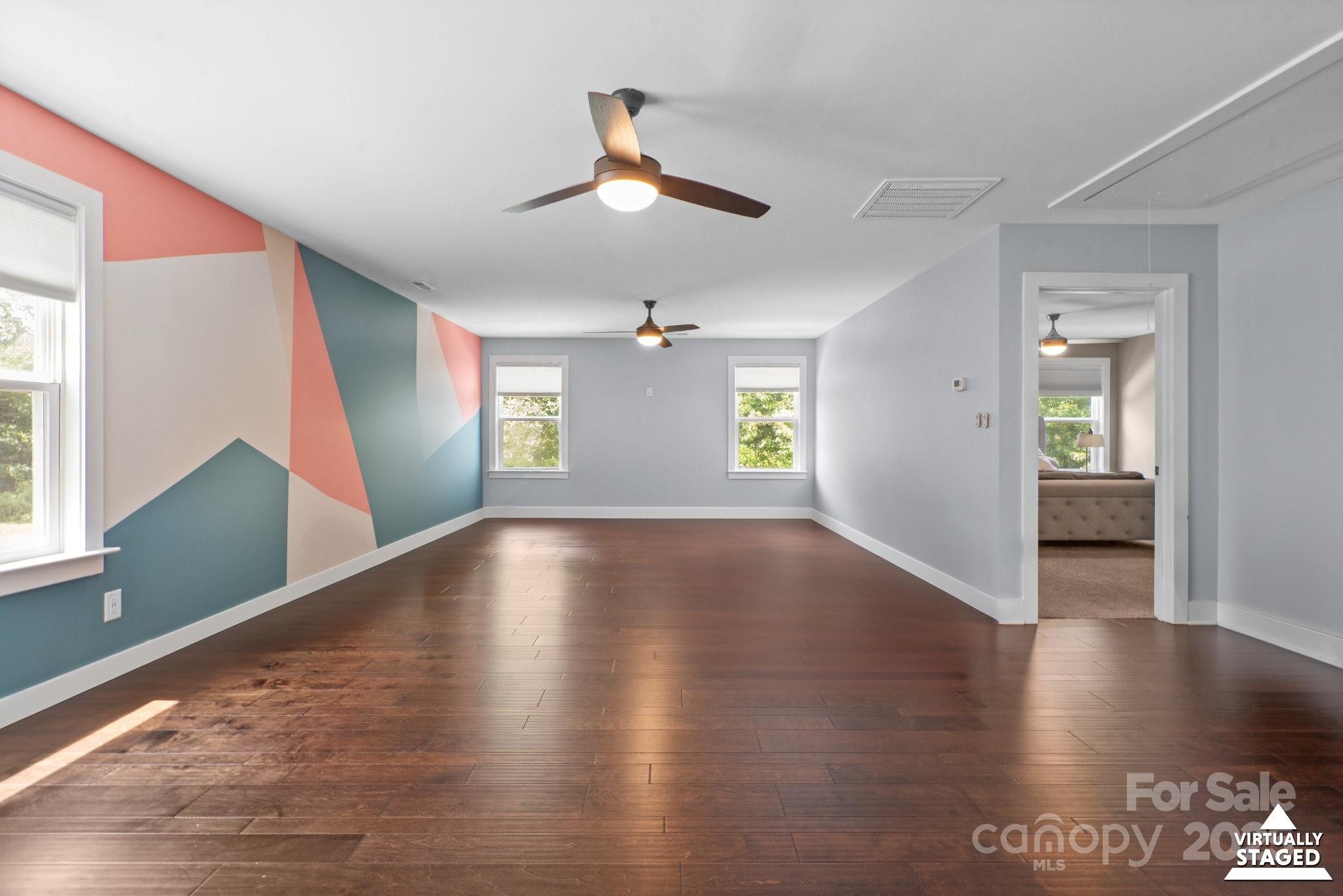 17423 Summers Walk Boulevard Davidson, NC 28036 - Photo 24 of 40 a view of empty room with wooden floor and fan