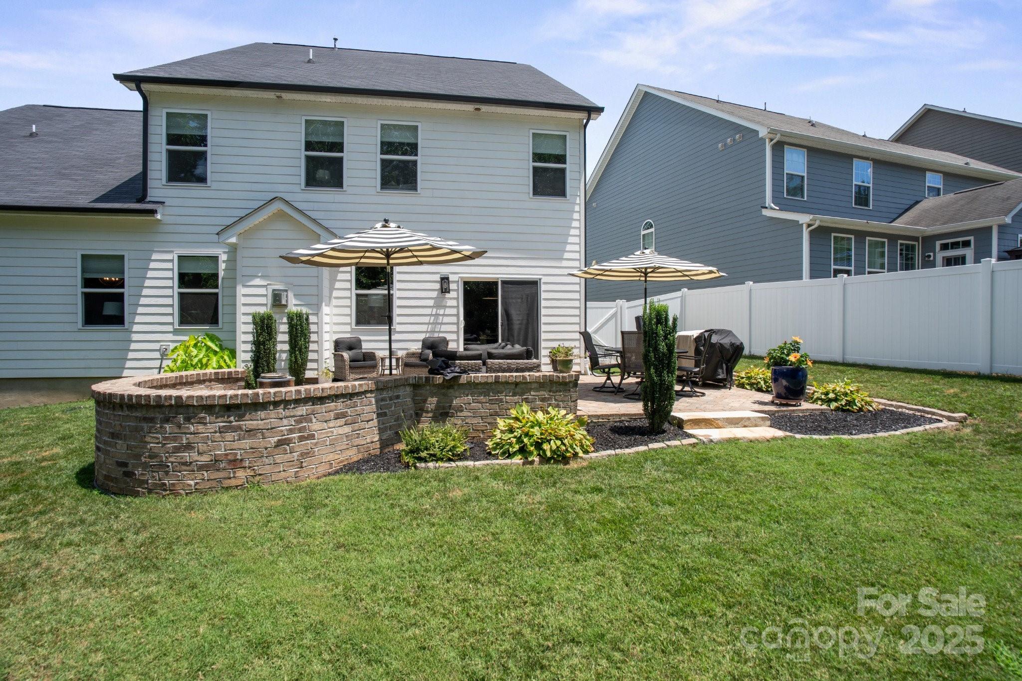17423 Summers Walk Boulevard Davidson, NC 28036 - Photo 31 of 40 a front view of a house with a garden