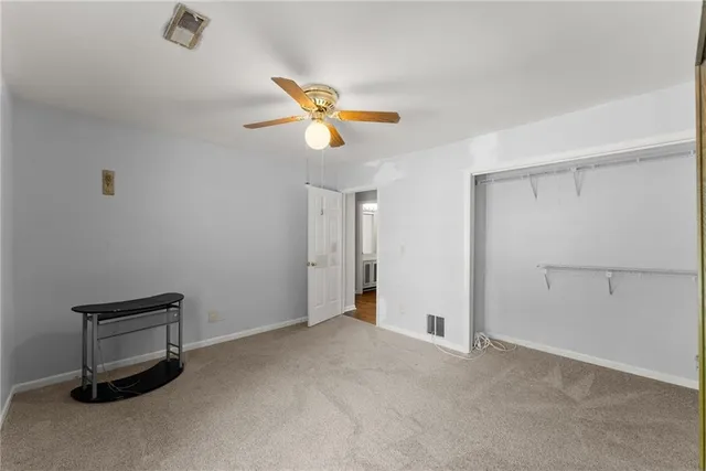 a view of a storage & utility room with a window