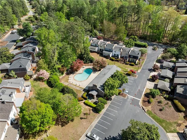 an aerial view of a house with yard swimming pool and outdoor seating