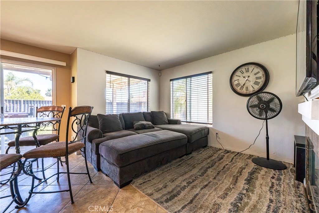 651 Viewpointe Lane Corona, CA 92881 - Photo 11 of 28 a living room with a bed furniture and a large window