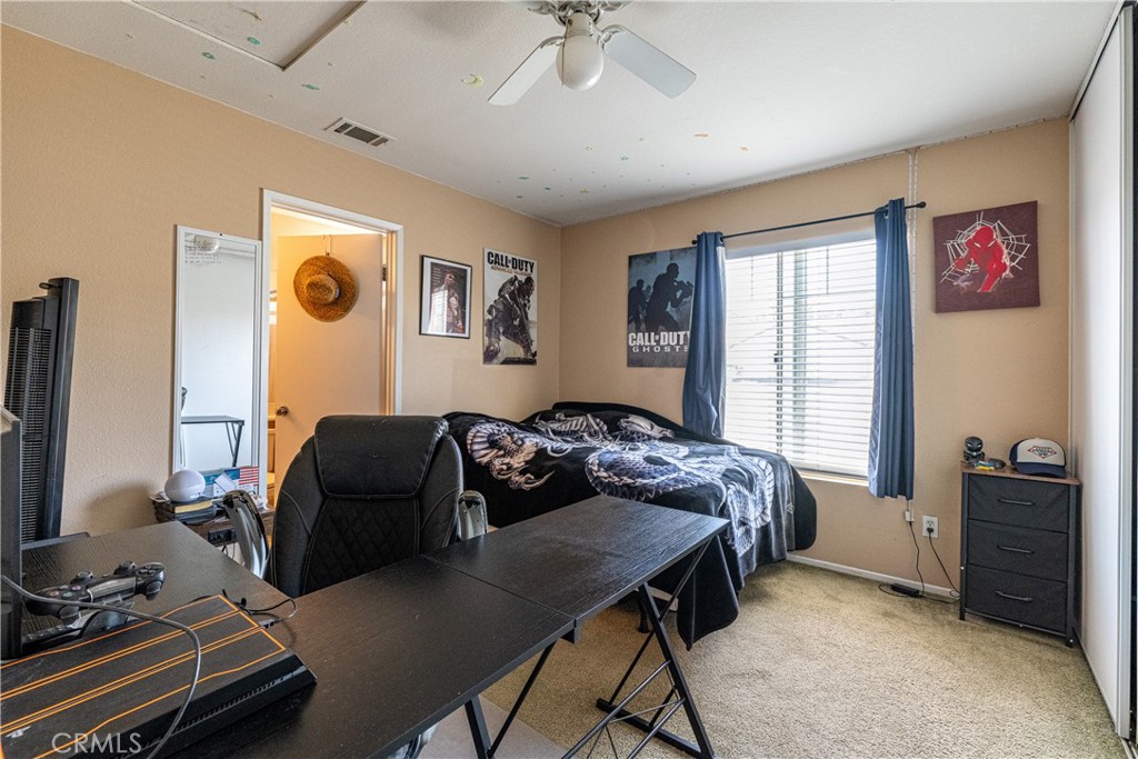 651 Viewpointe Lane Corona, CA 92881 - Photo 14 of 28 a bedroom with a bed and a dresser