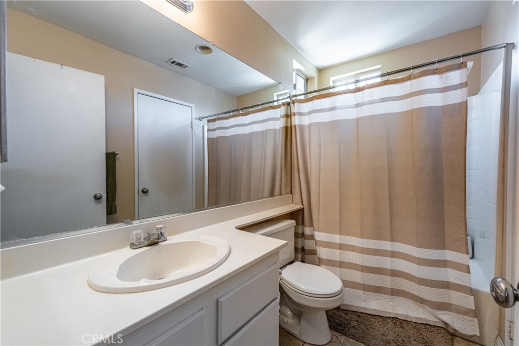 651 Viewpointe Lane Corona, CA 92881 - Photo 16 of 28 a bathroom with a sink and a mirror