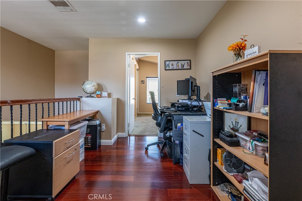 651 Viewpointe Lane Corona, CA 92881 - Photo 18 of 28 a dining room with furniture and a flat screen tv