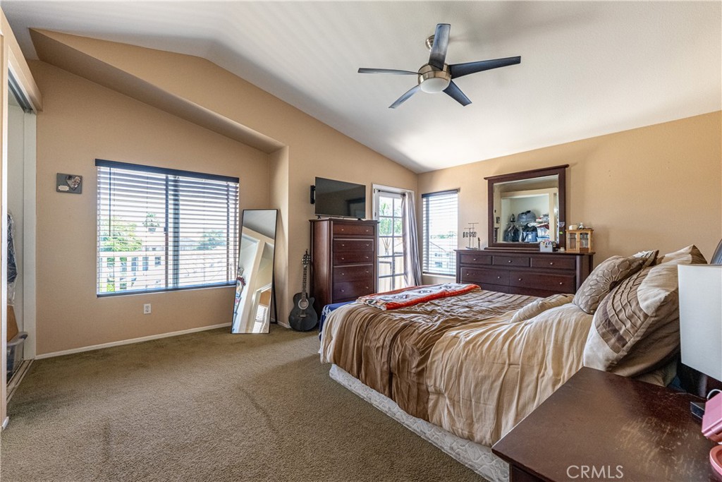 651 Viewpointe Lane Corona, CA 92881 - Photo 19 of 28 a bedroom with a bed and a ceiling fan