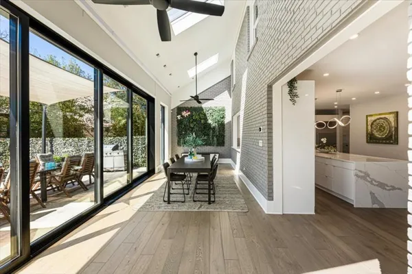 a spacious bedroom with a bed and a large window