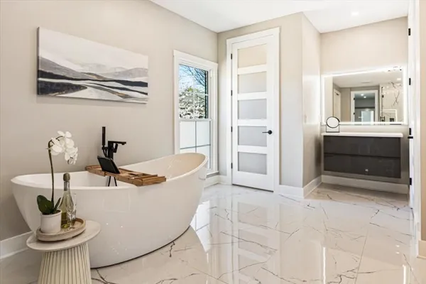 a very nice looking room with wooden floor and windows