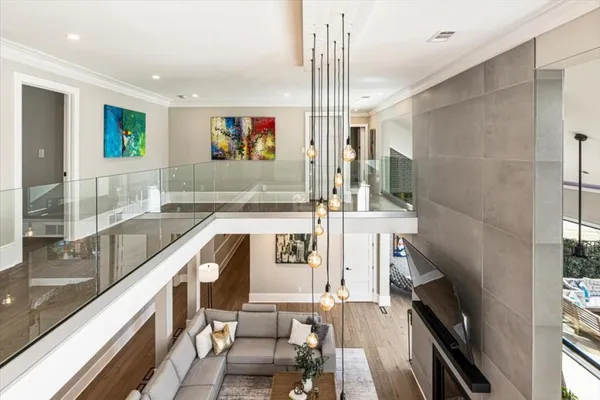 a living room with patio furniture and a floor to ceiling window