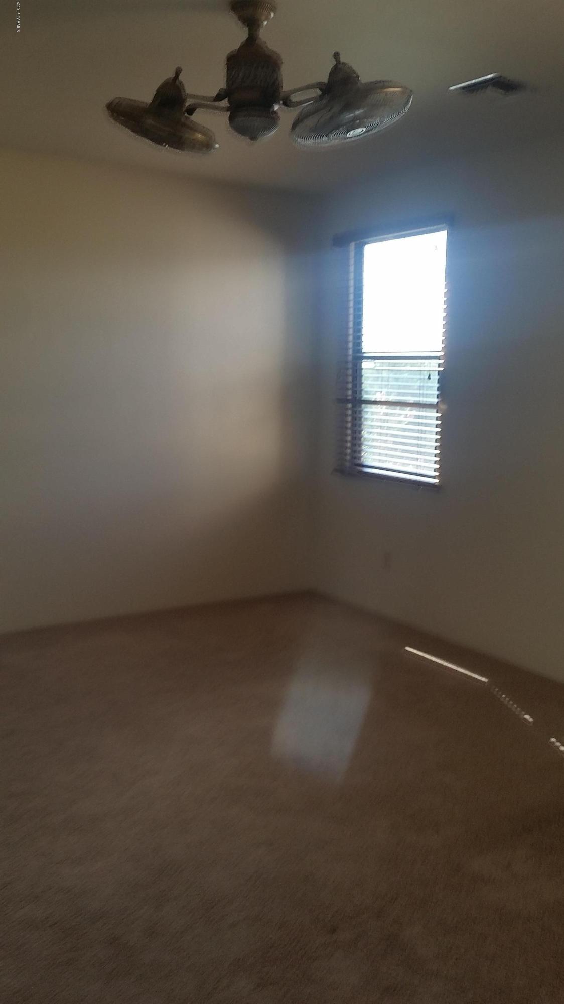 478 East Cedarvale Road Tucson, AZ 85704 - Photo 21 of 39 an empty room with a empty space and a window