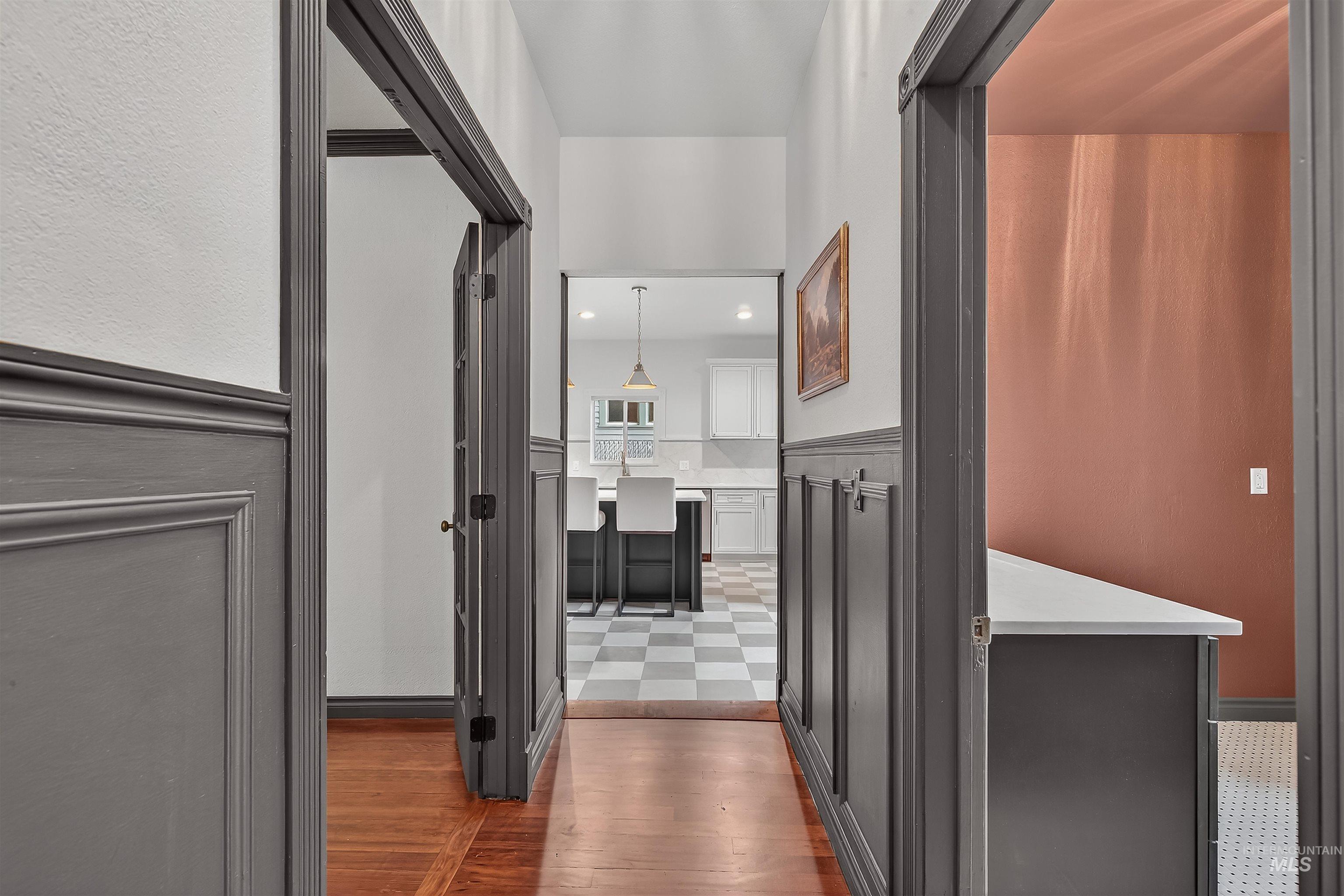 302 7th Avenue Lewiston, ID 83501 - Photo 15 of 50 Hallway with dark wood-style flooring, a wainscoted wall, and recessed lighting