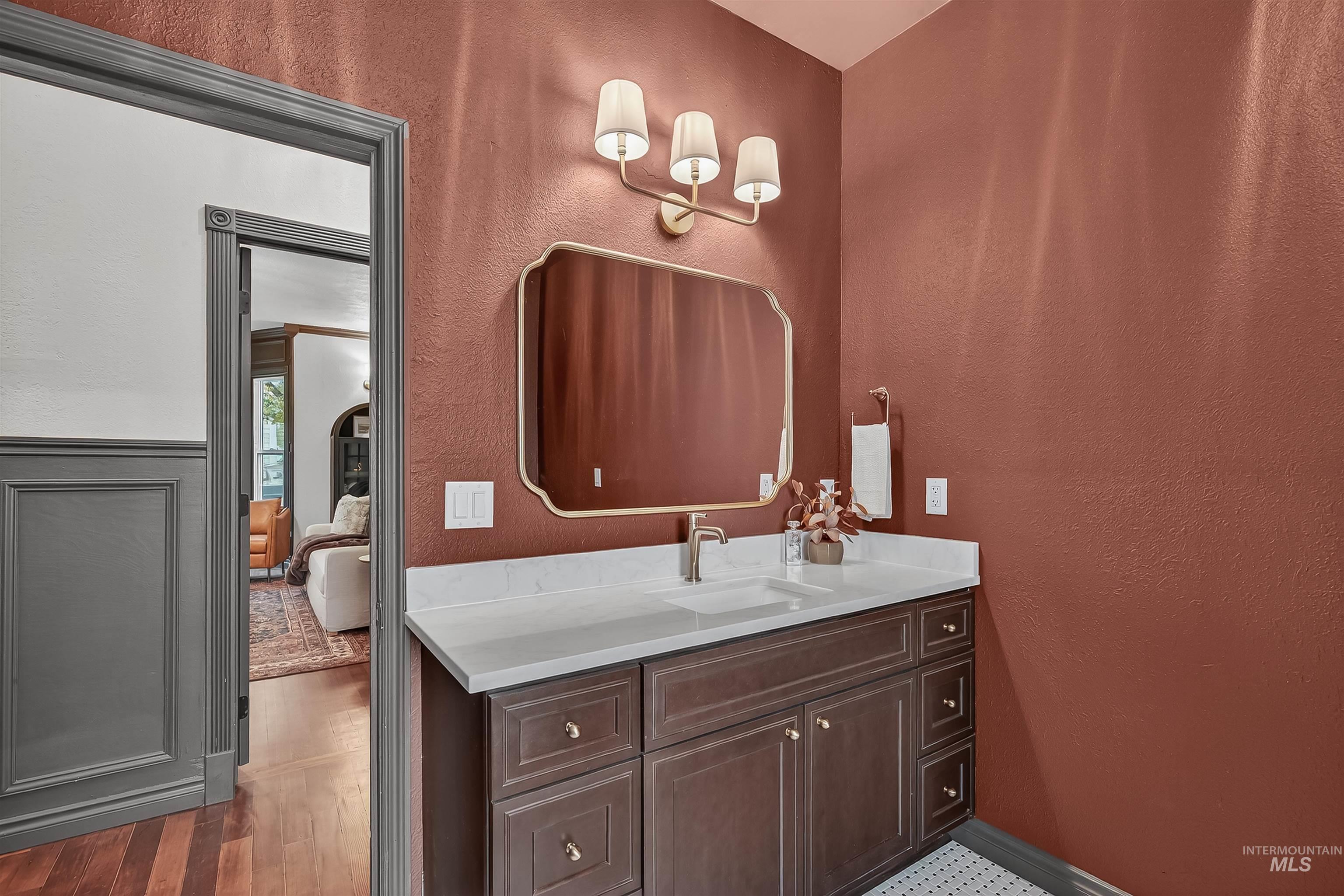 302 7th Avenue Lewiston, ID 83501 - Photo 16 of 50 Bathroom featuring a textured wall and vanity