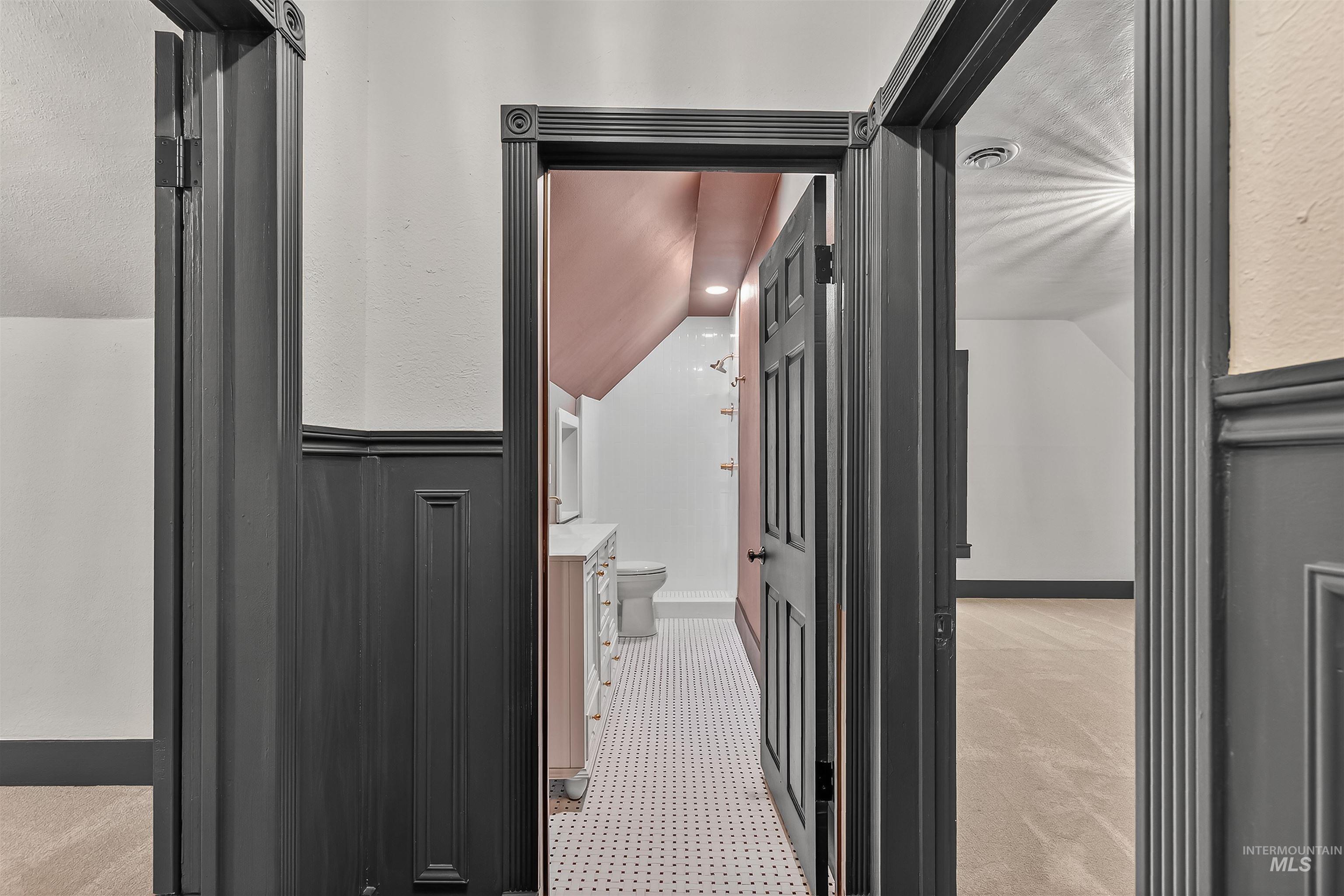 302 7th Avenue Lewiston, ID 83501 - Photo 25 of 50 Hallway featuring lofted ceiling and light colored carpet