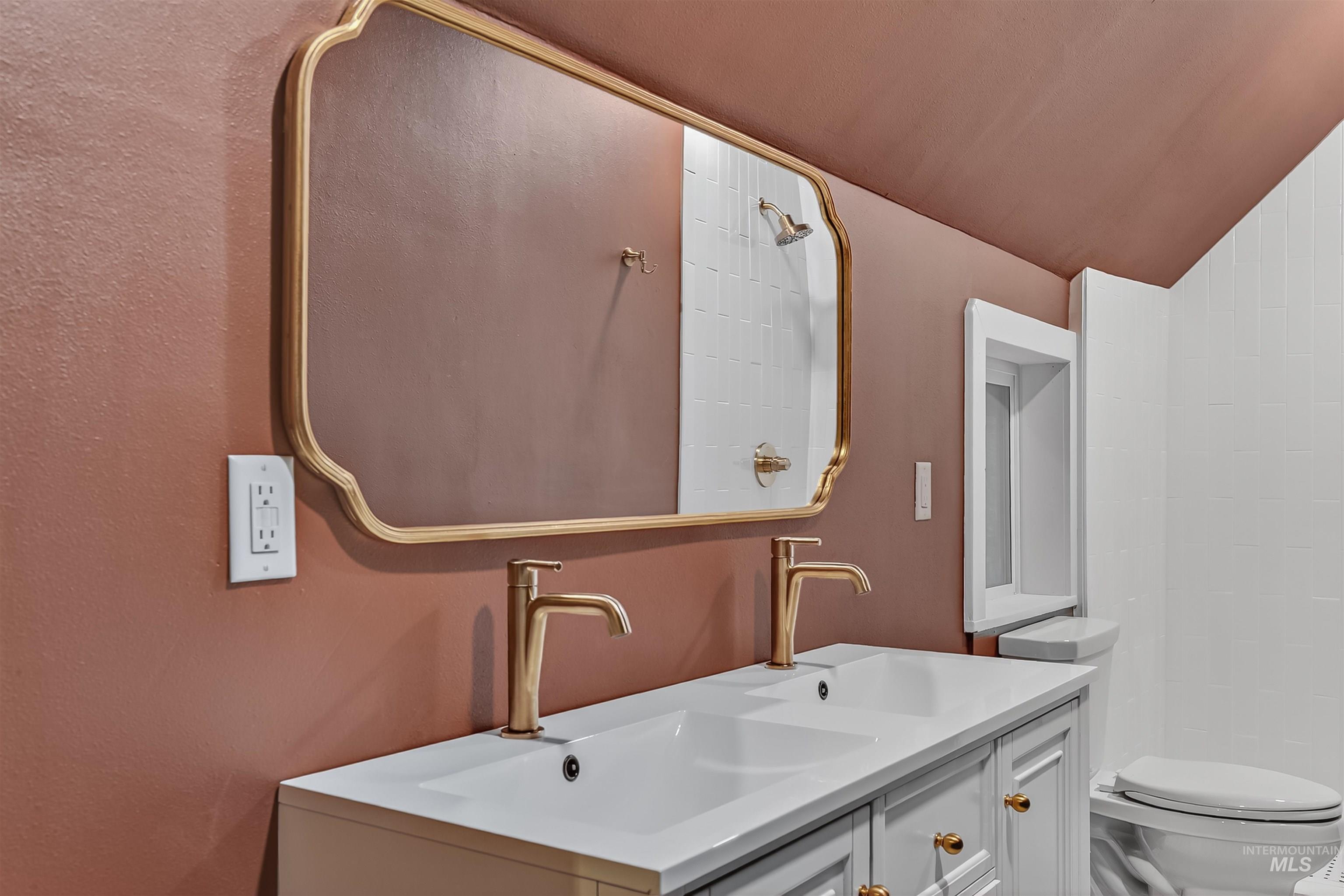 302 7th Avenue Lewiston, ID 83501 - Photo 26 of 50 Full bathroom with a shower, lofted ceiling, and vanity