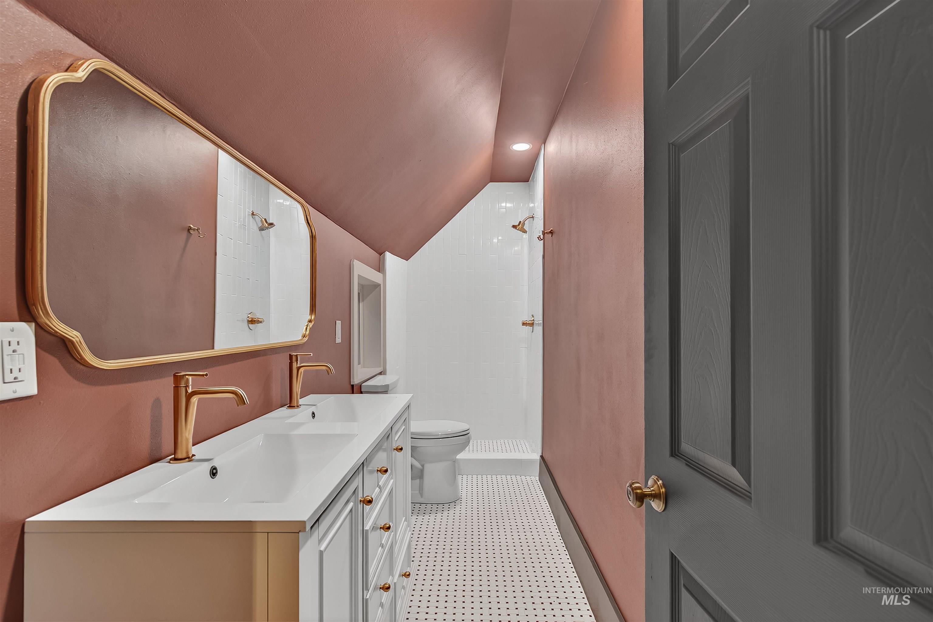 302 7th Avenue Lewiston, ID 83501 - Photo 27 of 50 Full bath with a shower stall, lofted ceiling, and double vanity