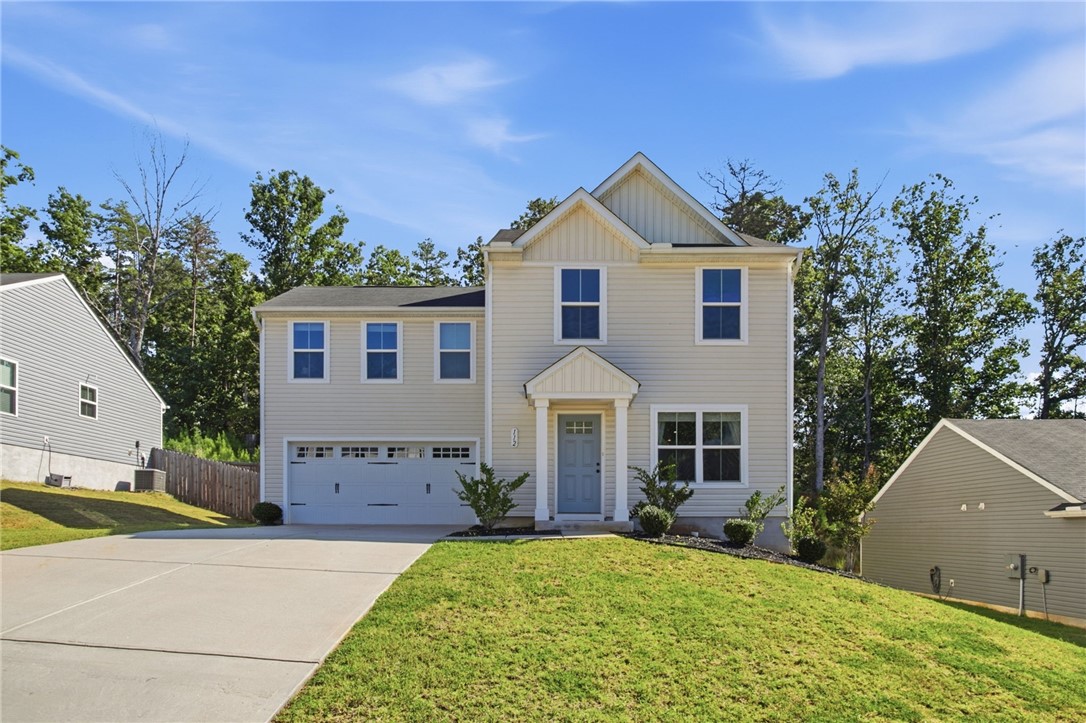 112 Wls Sta Road Seneca, SC 29678 - Photo 4 of 42 A spacious driveway leads to this classic multi-level home with a manicured front lawn.