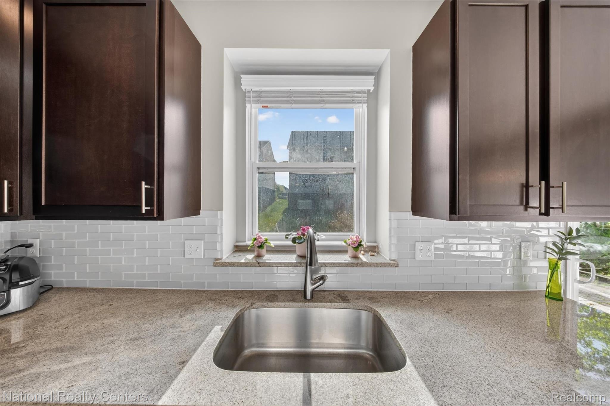 27412 Victoria Road Novi, MI 48374 - Photo 8 of 61 Kitchen featuring a stainless steel undermount sink, a chrome faucet, and a light-toned countertop