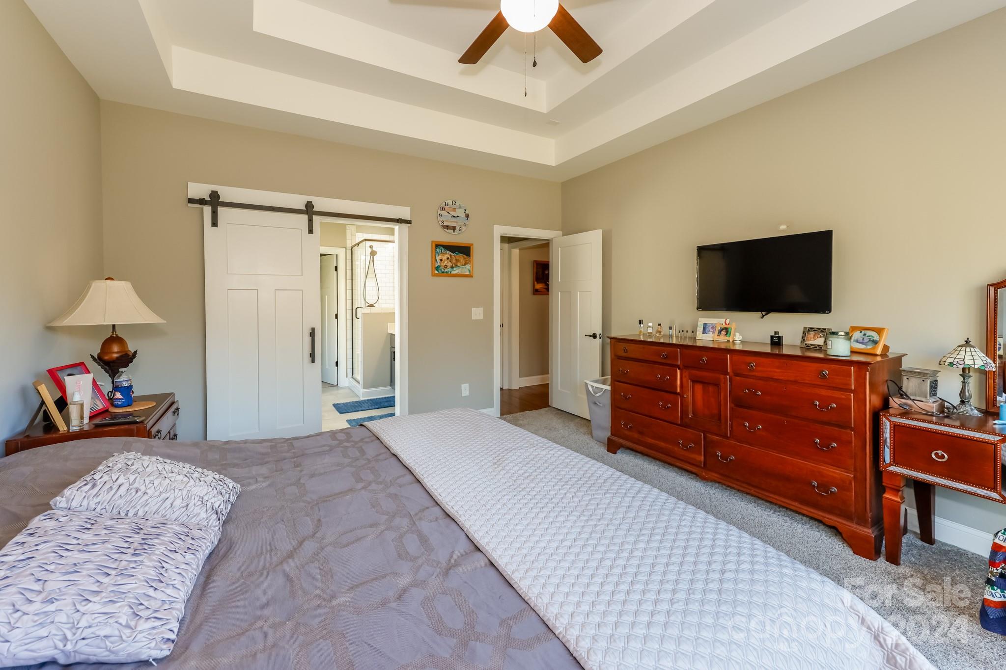 174 Spring Street Spindale, NC 28160 - Photo 11 of 30 a bedroom with a bed and flat screen tv