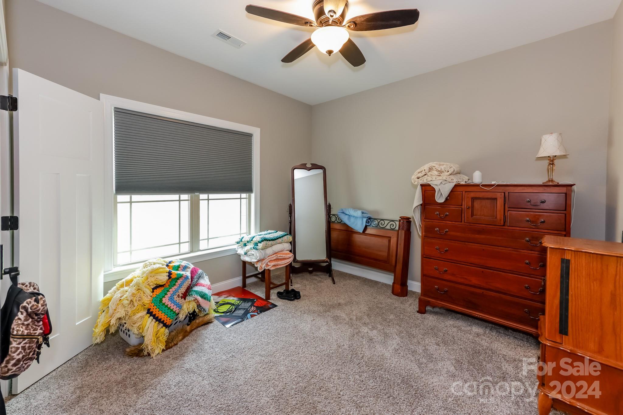 174 Spring Street Spindale, NC 28160 - Photo 17 of 30 a bedroom with furniture and a window