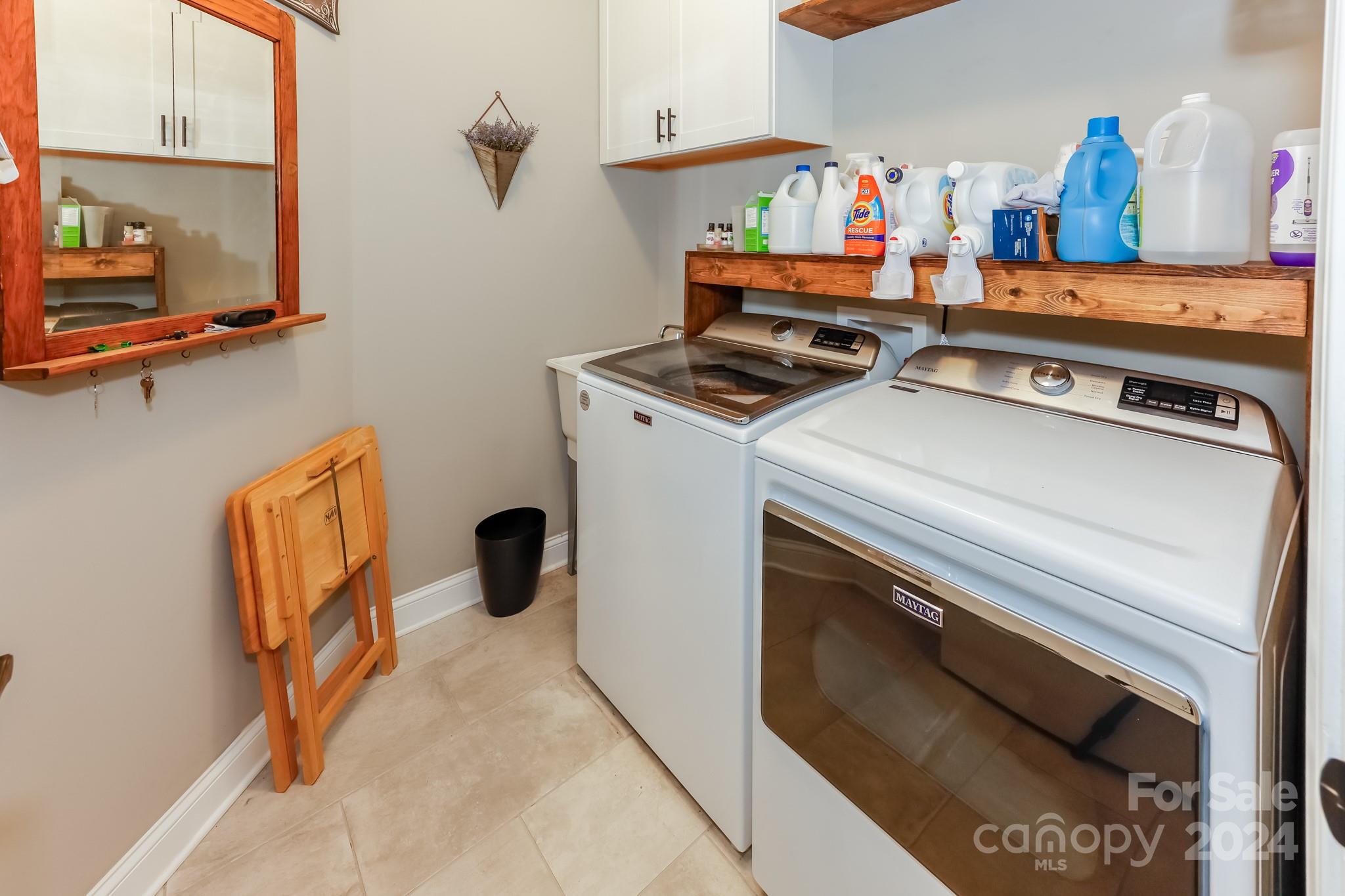 174 Spring Street Spindale, NC 28160 - Photo 18 of 30 a view of storage and utility room with washer and dryer